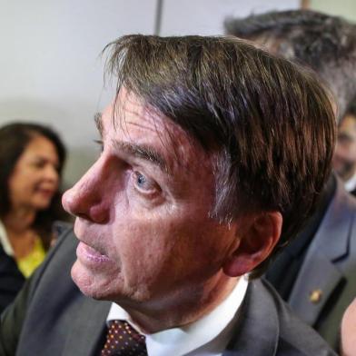 Brazils President-elect Jair Bolsonaro greets people during his visit to the Superior Court of Labour in Brasilia, on November 13, 2018. - Bolsonaro, who takes office on January 1, 2019, announced on Tuesday the appointment of reservist general Fernando Azevedo e Silva to the post of defense minister. (Photo by Sergio LIMA / AFP)