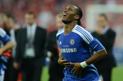 Chelseas Ivorian forward Didier Drogba celebrates after scoring a goal during the UEFA Champions League final football match between FC Bayern Muenchen and Chelsea FC on May 19, 2012 at the Fussball Arena stadium in Munich.. AFP PHOTO / ADRIAN DENNIS (Photo by ADRIAN DENNIS / AFP)