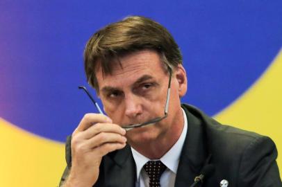 Brazil's President-elect Jair Bolsonaro, gestures during a meeting with the newly elected governors in Brasilia on November 14, 2018. (Photo by Sergio LIMA / AFP)