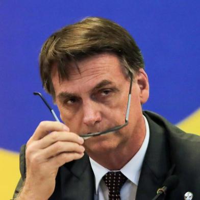 Brazils President-elect Jair Bolsonaro, gestures during a meeting with the newly elected governors in Brasilia on November 14, 2018. (Photo by Sergio LIMA / AFP)