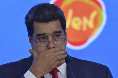 Venezuelas President Nicolas Maduro gestures while delivering a speech during the closing ceremony of the International Turism Fair at the Bolivar Park in Caracas, Venezuela on November 26, 2018. (Photo by YURI CORTEZ / AFP)