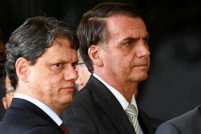 Brazilian President-elect Jair Bolsonaro (R) and his appointed Minister of Infrastructure Tarcisio Gomes de Freitas prepare to address the press at the transitional government's headquarters in Brasilia, on November 27, 2018. (Photo by EVARISTO SA / AFP)