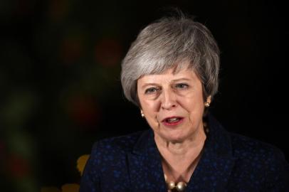 Britains Prime Minister Theresa May makes a statement outside 10 Downing Street in central London after winning a confidence vote on December 12, 2018. (Photo by Oli SCARFF / AFP)