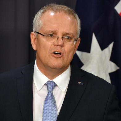 (FILES) In this file photo taken on August 24, 2018 Australias incoming Prime Minister Scott Morrison speaks at a press conference in Canberra. - Australia now recognises west Jerusalem as Israels capital, Prime Minister Scott Morrison said on December 15, 2018, but a contentious embassy shift from Tel Aviv will not occur until a peace settlement is achieved. (Photo by SAEED KHAN / AFP)