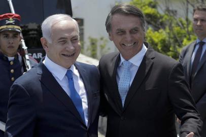 Israels Prime Minister Benjamin Netanyahu (L) is welcomed by Brazils President-elect Jair Bolsonaro at the Copacabana fort in Rio de Janeiro, Brazil, on December 28, 2018. - Netanyahu hailed what he said would be a new era in ties with great power Brazil ahead of a meeting with the Latin American countrys incoming far-right leader, Jair Bolsonaro, who takes office on January 1, 2019. (Photo by Leo CORREA / POOL / AFP)