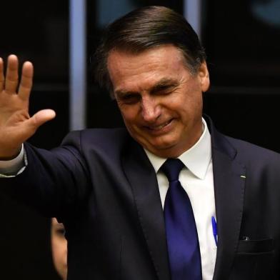  Brazils President-elect Jair Bolsonaro gestures at the Congress before he is sworn in as Brazils new president, in Brasilia on January 1, 2019. - Bolsonaro takes office with promises to radically change the path taken by Latin Americas biggest country by trashing decades of centre-left policies. (Photo by Nelson ALMEIDA / AFP)Editoria: POLLocal: BrasíliaIndexador: NELSON ALMEIDASecao: governmentFonte: AFPFotógrafo: STF