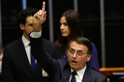  Jair Bolsonaro addresses Congress, during his swearing-in ceremony as Brazils new president, in Brasilia on January 1, 2019. - Bolsonaro takes office with promises to radically change the path taken by Latin Americas biggest country by trashing decades of centre-left policies. (Photo by NELSON ALMEIDA / AFP)Editoria: POLLocal: BrasíliaIndexador: NELSON ALMEIDASecao: governmentFonte: AFPFotógrafo: STF