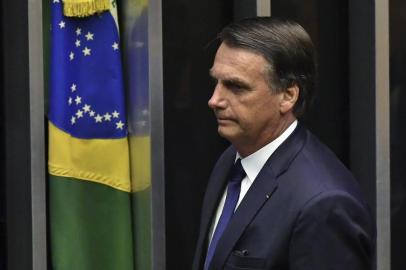  Brazils newly sworn-in President Jair Bolsonaro is pictured during his inauguration ceremony, at the Congress in Brasilia on January 1, 2019. - Bolsonaro takes office with promises to radically change the path taken by Latin Americas biggest country by trashing decades of centre-left policies. (Photo by NELSON ALMEIDA / AFP)Editoria: POLLocal: BrasíliaIndexador: NELSON ALMEIDASecao: governmentFonte: AFPFotógrafo: STF