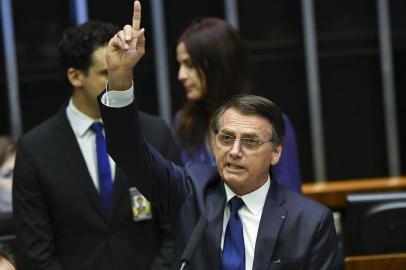  Jair Bolsonaro addresses Congress, during his swearing-in ceremony as Brazils new president, in Brasilia on January 1, 2019. - Bolsonaro takes office with promises to radically change the path taken by Latin Americas biggest country by trashing decades of centre-left policies. (Photo by NELSON ALMEIDA / AFP)Editoria: POLLocal: BrasíliaIndexador: NELSON ALMEIDASecao: governmentFonte: AFPFotógrafo: STF