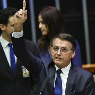  Jair Bolsonaro addresses Congress, during his swearing-in ceremony as Brazils new president, in Brasilia on January 1, 2019. - Bolsonaro takes office with promises to radically change the path taken by Latin Americas biggest country by trashing decades of centre-left policies. (Photo by NELSON ALMEIDA / AFP)Editoria: POLLocal: BrasíliaIndexador: NELSON ALMEIDASecao: governmentFonte: AFPFotógrafo: STF