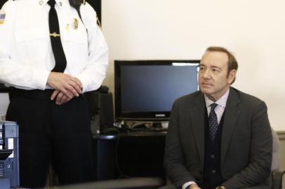 Kevin Spacey sits in chair while the legal teams meet during his arraignment at Nantucket District Court in Nantucket, Massachusetts on January 7, 2019. - Kevin Spacey was formally charged Monday with the indecent assault of a teenager who alleged the US actor groped him at a bar in Massachusetts in 2016. The House of Cards star was not asked for his plea during the brief arraignment in a crowded Nantucket courtroom, but local media said his lawyer entered a plea of not guilty on his behalf.A follow-on hearing was scheduled for March 4,2019 but Spacey was not required to attend. (Photo by Nicole Harnishfeger / POOL / AFP)