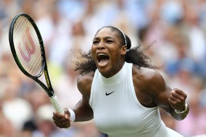 US player Serena Williams celebrates winning the first set against Germany's Angelique Ker