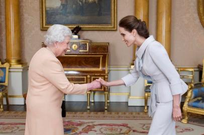 US actress Angelina Jolie (R) is presented with the Insignia of an Honorary Dame Grand Cro