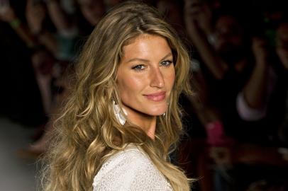 Brazilian supermodel Gisele Bundchen presents a creation by Colcci during the 2015 Summer