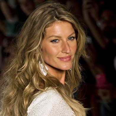 Brazilian supermodel Gisele Bundchen presents a creation by Colcci during the 2015 Summer