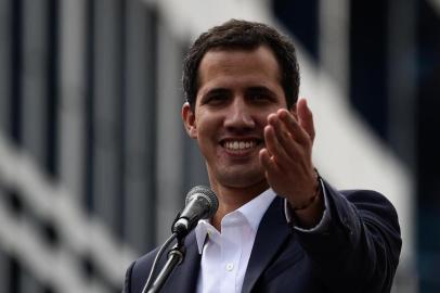  Venezuelas National Assembly head Juan Guaido speaks to the crowd during a mass opposition rally against leader Nicolas Maduro in which he declared himself the countrys acting president, on the anniversary of a 1958 uprising that overthrew a military dictatorship, in Caracas on January 23, 2019. - I swear to formally assume the national executive powers as acting president of Venezuela to end the usurpation, (install) a transitional government and hold free elections, said Guaido as thousands of supporters cheered. Moments earlier, the loyalist-dominated Supreme Court ordered a criminal investigation of the opposition-controlled legislature. (Photo by Federico PARRA / AFP)Editoria: WARLocal: CaracasIndexador: FEDERICO PARRASecao: crisisFonte: AFPFotógrafo: STF