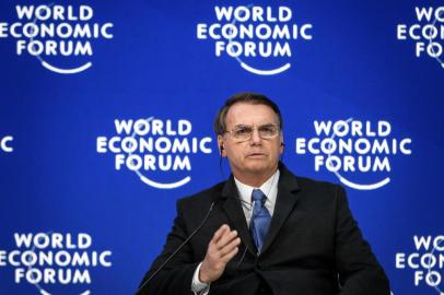 Brazilian President Jair Bolsonaro gestures as he delivers a speech during the World Economic Forum (WEF) annual meeting on January 22, 2019 in Davos, eastern Switzerland. (Photo by Fabrice COFFRINI / AFP)