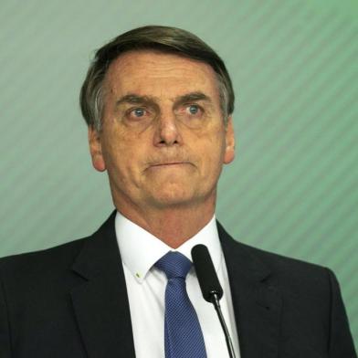 Brazilian President Jair Bolsonaro gives a statement in Brasilia on January 25, 2019 after the collapse of a dam near Brumadinho in southeastern Brazil. - A dam collapse in southeastern Brazil unleashed a torrent of mud on a riverside town and surrounding farmland Friday, destroying houses, leaving 200 people missing and raising fears of a number of deaths, according to officials. The dam belonged to Brazilian mining giant Vale. (Photo by Sergio LIMA / AFP)