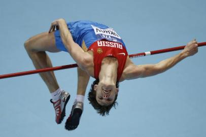  (FILES) In this file photo taken on March 9, 2014 Russias Ivan Ukhov competes in the men High Jump Final event at the IAAF World Indoor Athletics Championships in the Ergo Arena in the Polish coastal town of Sopot. - Ukhov is one of twelve Russian track and field athletes suspended for doping as announced on February 1, 2019. (Photo by Adrian DENNIS / AFP)Editoria: SPOLocal: SopotIndexador: ADRIAN DENNISSecao: athletics, track and fieldFonte: AFPFotógrafo: STF