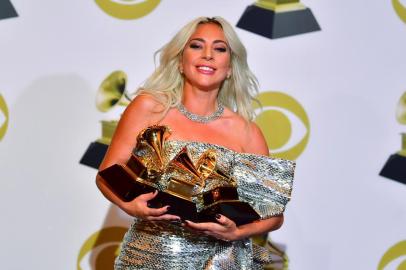  Singer/songwriter Lady Gaga poses with her award for Best Pop Solo Performance with Joanne, Best Pop Duo/Group Performance Shallow and Best Song Written for Visual Media Shallow in the press room during the 61st Annual Grammy Awards on February 10, 2019, in Los Angeles. (Photo by FREDERIC J. BROWN / AFP)Editoria: ACELocal: Los AngelesIndexador: FREDERIC J. BROWNSecao: musicFonte: AFPFotógrafo: STF