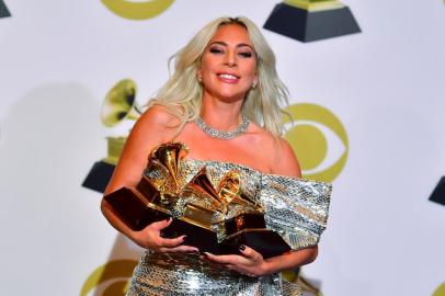  Singer/songwriter Lady Gaga poses with her award for Best Pop Solo Performance with Joanne, Best Pop Duo/Group Performance Shallow and Best Song Written for Visual Media Shallow in the press room during the 61st Annual Grammy Awards on February 10, 2019, in Los Angeles. (Photo by FREDERIC J. BROWN / AFP)Editoria: ACELocal: Los AngelesIndexador: FREDERIC J. BROWNSecao: musicFonte: AFPFotógrafo: STF