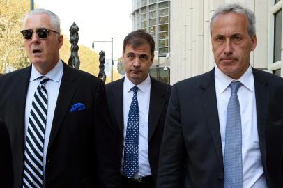  Alejandro Burzaco (C) leaves the US District Courthouse in Brooklyn September 18, 2015 in New York. Burzaco was to appear before a judge to answer to charges of bribery and corruption linked to the massive FIFA scandal. AFP PHOTO/DON EMMERT (Photo by DON EMMERT / AFP)Editoria: CLJLocal: New YorkIndexador: DON EMMERTSecao: crimeFonte: AFPFotógrafo: STR