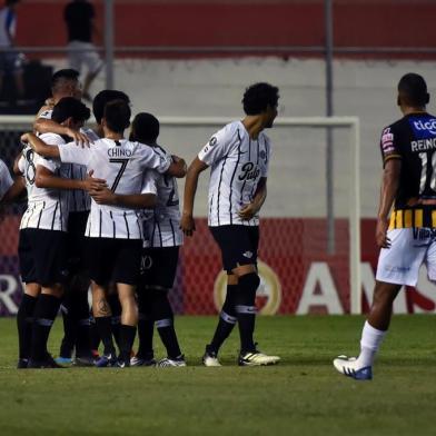 Paraguays Libertad player Oscar Cardozo (2-L) celebrates with teammates after scoring a goal against Bolivias The Strongest during a Copa Libertadores football match at Nicolas Leoz stadium in Asuncion, on February 13, 2019. (Photo by NORBERTO DUARTE / AFP)