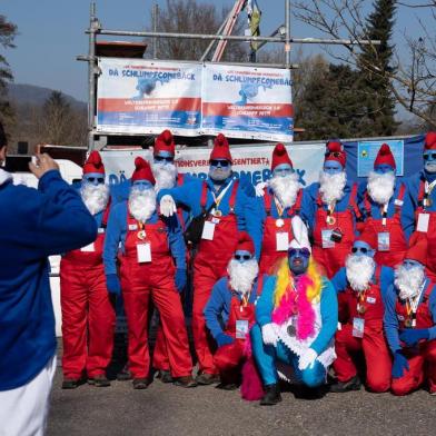 Participants pose for a picture during a gathering of people dressed as smurfs (small blue fictional creatures created by Belgian cartoonist Pierre Culliford)  to be counted as part of a world record attempt on February 16, 2019 in Lauchringen, Germany. (Photo by Constant FORME-BECHERAT / AFP)