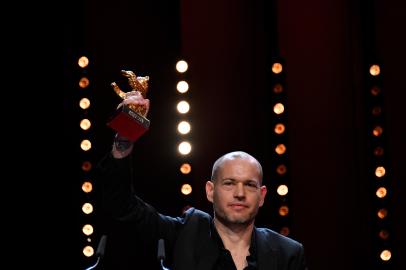 Israeli director Nadav Lapid celebrates with his Golden bear for best film for ¿??Synonymes¿?? during the awards ceremony of the 69th Berlinale film festival on February 16, 2019 in Berlin. 