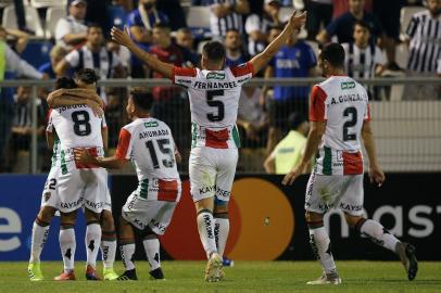 Chiles Palestino midfielder Cristobal Jorquera (L) celebrates with teammates his goal against Argentinas Talleres de Cordoba during a Copa Libertadores football match at San Carlos de Apoquindo Stadium in Santiago, on February 27, 2019. 