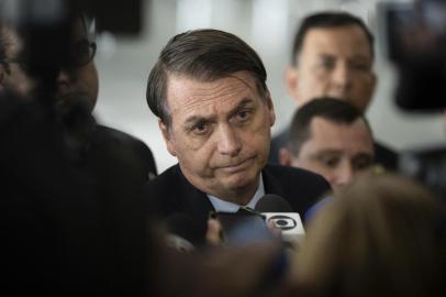 Brazils President Jair Bolsonaro speaks to reporters after receiving Paraguays President Mario Abdo Benitez (out of frame) at Planalto palace in Brasilia on March 12, 2019. (Photo by Sergio LIMA / AFP)