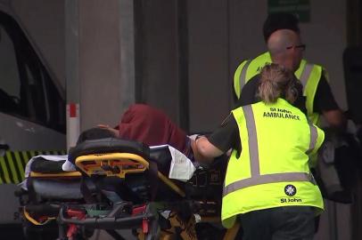 An image grab from TV New Zealand taken on March 15, 2019 shows a victim arriving at a hospital following the mosque shooting in Christchurch. - At least one gunman who targeted crowded mosques in the New Zealand city of Christchurch killed a number of people, police said, with Prime Minister Jacinda Ardern describing the shooting as one of New Zealands darkest days. (Photo by TV New Zealand / TV New Zealand / AFP) / New Zealand OUT / XGTY----EDITORS NOTE ----RESTRICTED TO EDITORIAL USE MANDATORY CREDIT  AFP PHOTO / TV New Zealand / NO MARKETING NO ADVERTISING CAMPAIGNS - DISTRIBUTED AS A SERVICE TO CLIENTS- NO ARCHIVE