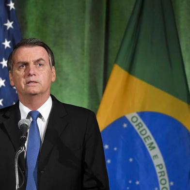 Brazils President Jair Bolsonaro speaks during a discussion on US-Brazil relations at the US Chamber of Commerce in Washington, DC on March 18, 2019. (Photo by MANDEL NGAN / AFP)