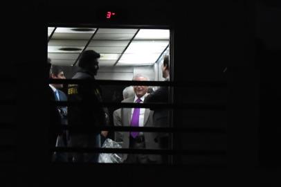 Brazils former president (2016-2018) Michel Temer (purple tie), leaves the Federal Police headquarters in Rio de Janeiro, Brazil, on March 25, 2019, after a Brazilian judge ordered his immediate release, days after he was detained on allegations of being the leader of a criminal organization. - Temer, who was arrested Thursday in Sao Paulo and transferred to Rio de Janeiro, is the second ex-president of the Latin American country to be caught up in a sprawling, years-long anti-corruption probe called Car Wash that has claimed scores of political and corporate scalps. The preventative detention of Temer, the 78-year-old predecessor of the current far-right President Jair Bolsonaro, had no legal justification, judge Antonio Ivan Athie said in the ruling. (Photo by MAURO PIMENTEL / AFP)