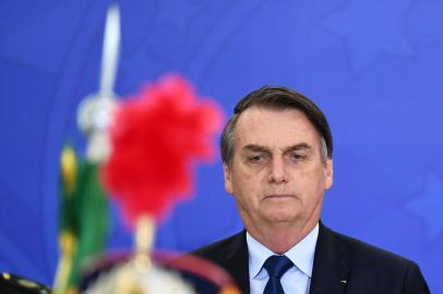 Brazilian President Jair Bolsonaro attends the new general officers' promotion ceremony at the Planalto Palace in Brasilia, on April 5, 2019. - Bolsonaro completes his first 100 days of government next April 10. (Photo by EVARISTO SA / AFP)