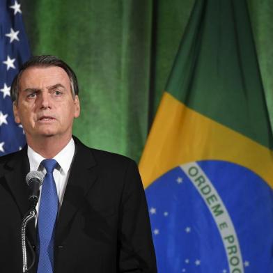 Brazil's President Jair Bolsonaro speaks during a discussion on US-Brazil relations at the US Chamber of Commerce in Washington, DC on March 18, 2019. (Photo by MANDEL NGAN / AFP)