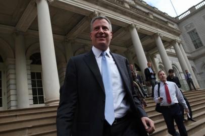 NEW YORK, NY - NOVEMBER 06: New York City Mayor-elect Bill de Blasio leaves City Hall after meeting with outgoing Mayor Michael Bloomberg on November 6, 2013 in New York City. It was the first meeting between the two since de Blasio's election victory the day before.   John Moore/Getty Images/AFP