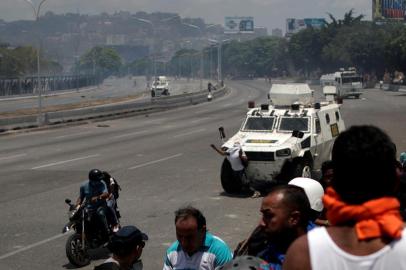 Opposition demonstration near the Generalisimo Francisco de Miranda Airbase La Carlota in CaracasATTENTION EDITORS - VISUAL COVERAGE OF SCENES OF INJURY OR DEATH An opposition demonstrator is struck by a Venezuelan National Guard vehicle on a street near the Generalisimo Francisco de Miranda Airbase La Carlota in Caracas, Venezuela April 30, 2019. REUTERS/Ueslei Marcelino ORG XMIT: COU218Local: CARACAS ;Venezuela