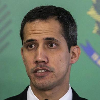  Venezuelan opposition leader and self-declared acting president Juan Guaido, speaks during a joint press conference with Brazils President Jair Bolsonaro (out of frame) at Planalto palace in Brasilia on February 28, 2019. - Venezuelas opposition leader Juan Guaido was looking to secure reinforced Brazilian support from President Jair Bolsonaro on Thursday ahead of his return home to continue his challenge to socialist leader Nicolas Maduro. There are fears he might be arrested upon his return to Venezuela. (Photo by Sergio LIMA / AFP)Editoria: WARLocal: BrasíliaIndexador: SERGIO LIMASecao: crisisFonte: AFPFotógrafo: STR