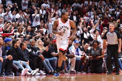 Eastern Conference Semi-Finals - Philadelphia 76ers v Toronto RaptorsTORONTO, CANADA - MAY 12: Kawhi Leonard #2 of the Toronto Raptors looks on against the Philadelphia 76ers during Game Seven of the Eastern Conference Semi-Finals of the 2019 NBA Playoffs on May 12, 2019 at the Scotiabank Arena in Toronto, Ontario, Canada. NOTE TO USER: User expressly acknowledges and agrees that, by downloading and or using this Photograph, user is consenting to the terms and conditions of the Getty Images License Agreement. Mandatory Copyright Notice: Copyright 2019 NBAE   Jesse D. Garrabrant/NBAE via Getty Images/AFPEditoria: SPOLocal: TorontoIndexador: Jesse D. GarrabrantSecao: BasketballFonte: NBAE / Getty ImagesFotógrafo: Contributor