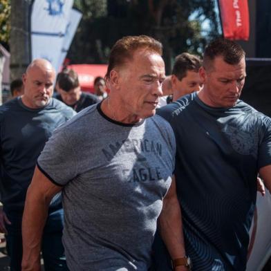 US actor and former California Governor Arnold Schwarzenegger (C) is seen at the Arnold Classic Africa, a multi-sport festival held at the Sandton Convention Centre on May 18, 2019 in Johannesburg, South Africa. (Photo by Michele Spatari / AFP)