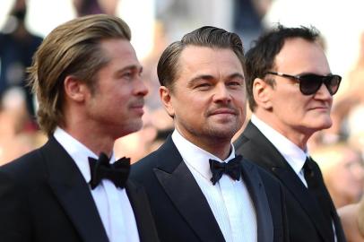 (FromL) US actor Brad Pitt, US actor Leonardo DiCaprio, US film director, screenwriter, producer, and actor Quentin Tarantino and Australian actress Margot Robbie arrive for the screening of the film Once Upon a Time... in Hollywood at the 72nd edition of the Cannes Film Festival in Cannes, southern France, on May 21, 2019. (Photo by LOIC VENANCE / AFP)