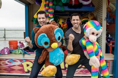 Jonathon and Drew Scott explore the midway at the historic Pleasure Pier in Galveston, TX, as seen on Brother vs. Brother.