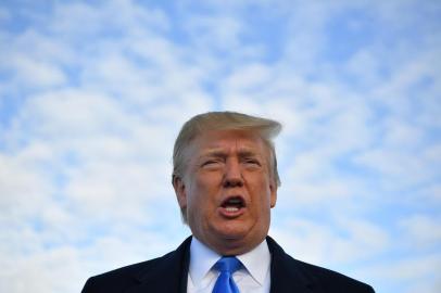 (FILES) In this file photo taken on June 5, 2019 US President Donald Trump speaks before boarding Air Force One at Shannon Airport in Shannon, Ireland, and fly to Normandy, France, to attend the 75th D-Day Anniversary. - US President Donald Trump said late on June 7, 2019 that Washington had reached an agreement with Mexico on migration, and that the punishing tariffs he had been threatening were indefinitely suspended. (Photo by MANDEL NGAN / AFP)