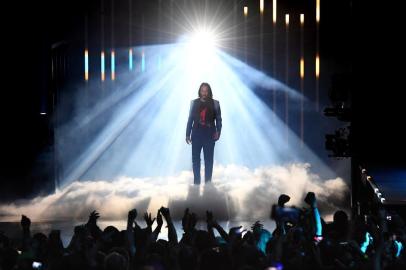 Canadian-US actor Keanu Reeves announces the new video game "Cyberpunk 2077" at the Microsoft Xbox press event ahead of the E3 gaming convention in Los Angeles on June 9, 2019. (Photo by Mark RALSTON / AFP)