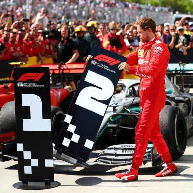 F1 Grand Prix of CanadaMONTREAL, QC - JUNE 09: Second placed Sebastian Vettel of Germany and Ferrari swaps the number boards at parc ferme during the F1 Grand Prix of Canada at Circuit Gilles Villeneuve on June 09, 2019 in Montreal, Canada.   Dan Istitene/Getty Images/AFPEditoria: SPOLocal: MontrealIndexador: Dan IstiteneSecao: Motor RacingFonte: GETTY IMAGES NORTH AMERICAFotógrafo: STF