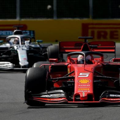 MONTREAL, QUEBEC - JUNE 09: Sebastian Vettel of Germany driving the (5) Scuderia Ferrari SF90 leads Lewis Hamilton of Great Britain driving the (44) Mercedes AMG Petronas F1 Team Mercedes W10 on track during the F1 Grand Prix of Canada at Circuit Gilles Villeneuve on June 09, 2019 in Montreal, Canada.   Charles Coates/Getty Images/AFP