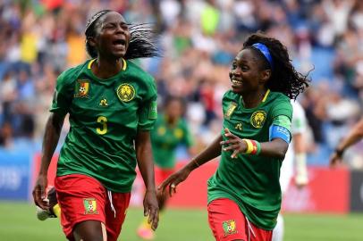 Cameroons forward Ajara Nchout (L) celebrates with Cameroons forward Gabrielle Onguene after scoring her second goal  during the France 2019 Womens World Cup Group E football match between Cameroon and New Zealand, on June 20, 2019, at the Mosson Stadium in Montpellier, southern France. (Photo by Pascal GUYOT / AFP)