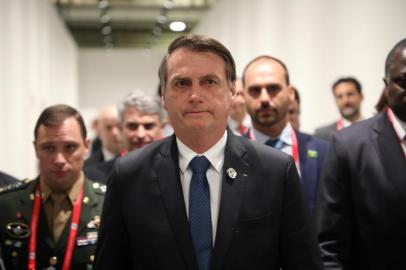 Brazilian President Jair Bolsonaro walks out from a bilateral meeting on the sideline of the G20 Osaka Summit in Osaka on June 28, 2019. 