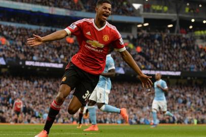 Manchester Uniteds English striker Marcus Rashford celebrates scoring his teams first goal during the English 